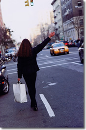 woman calling for taxi, city life