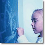 girl writing on chalkboard